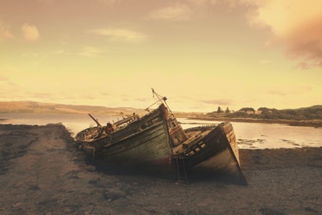 Boats abandoned on a deserted beach